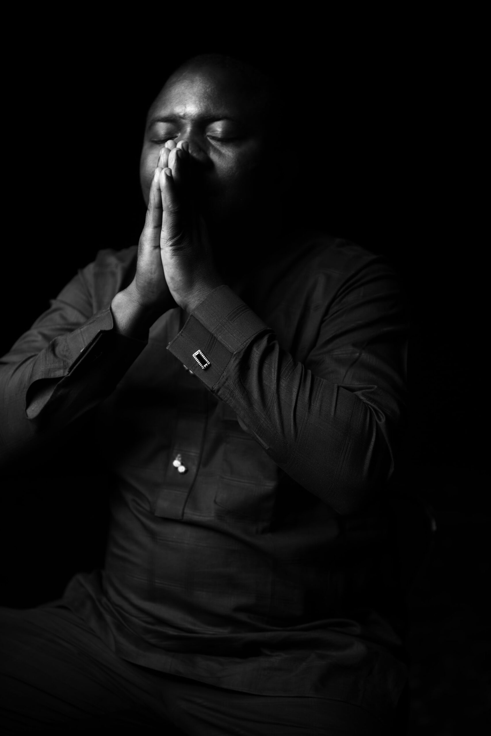 ktmd-entertainment-bnHTJCFBKkY-unsplash man with praying hands black and white
