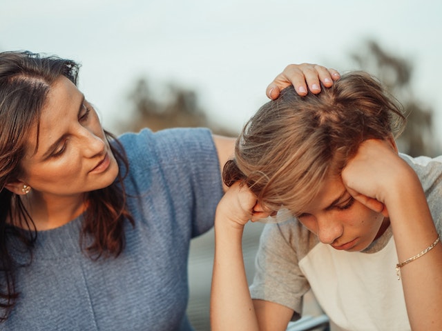 mom having conversation with son mom having conversation with son